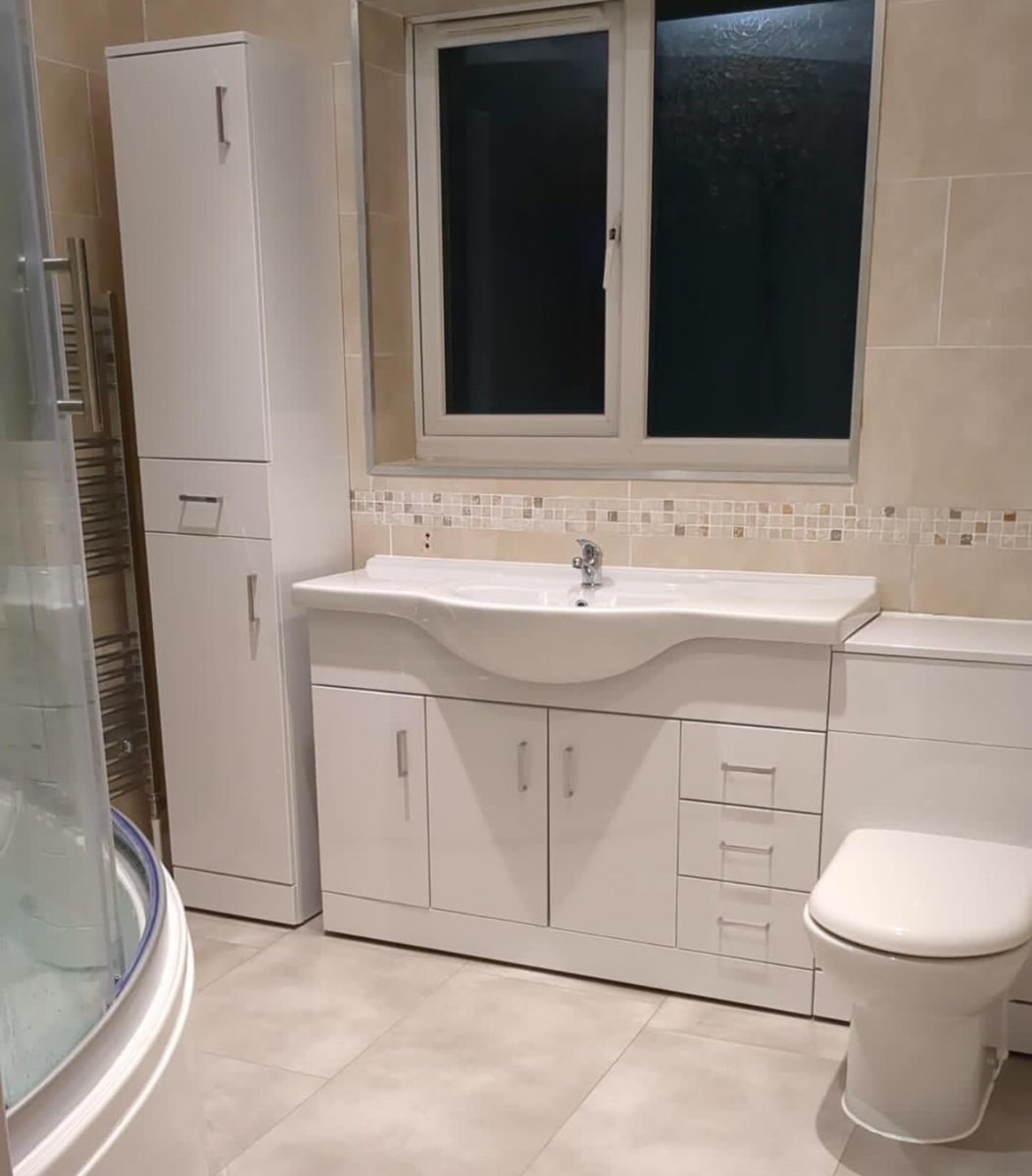 Full bathroom with white vanity unit, basin and toilet