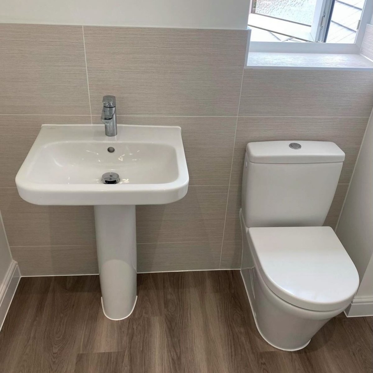 Cloakroom with a pedestal basin and toilet