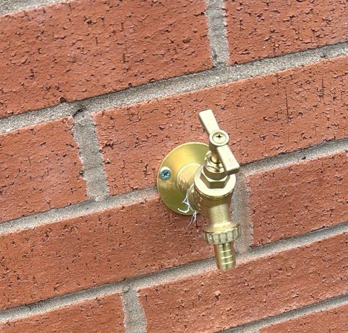 Neatly fitted outdoor garden tap