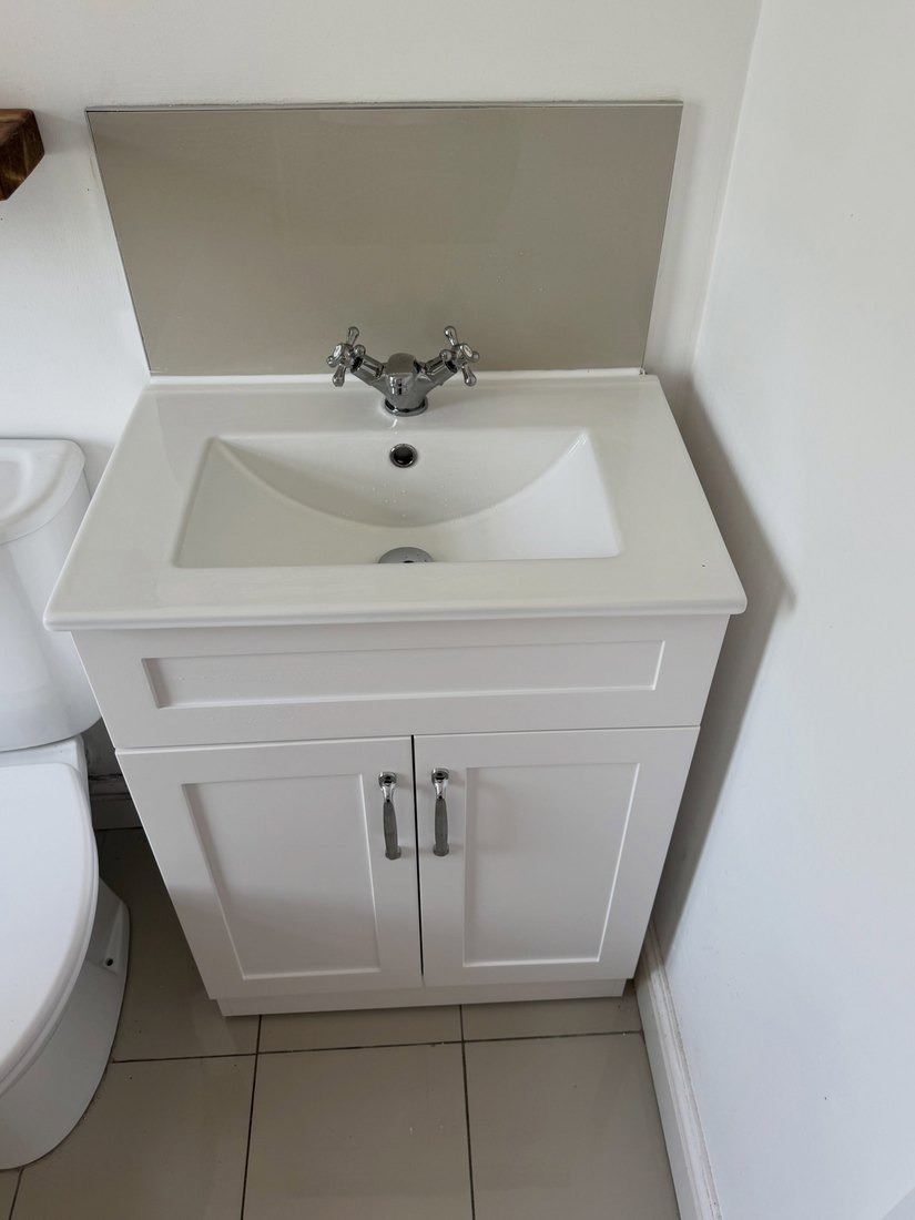 White basin and vanity unit with a mono tap