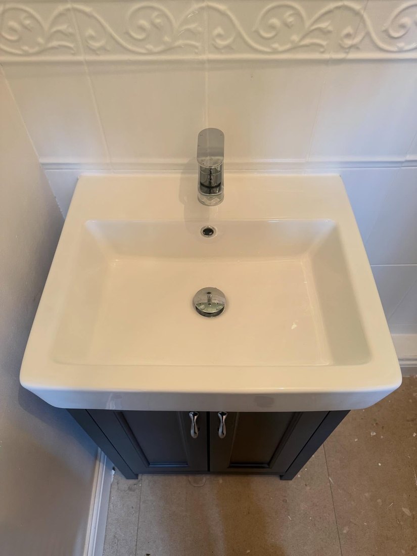 New basin and mono tap on a navy vanity unit